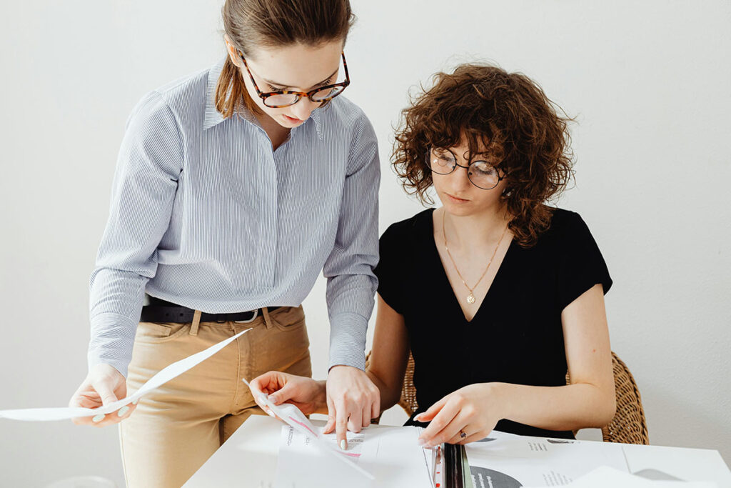 two coworkers going over a marketing plan